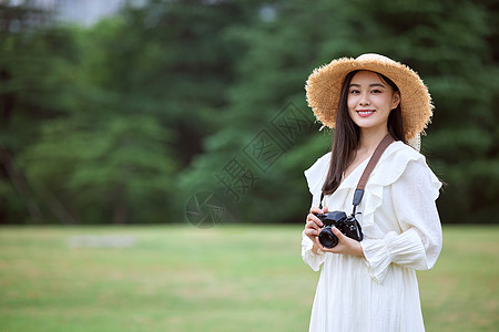 文艺女摄影师形象图片