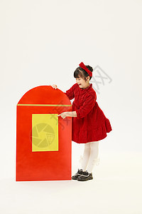 新年小女孩手拿大红包形象背景图片