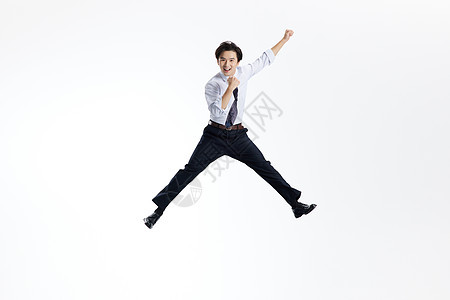 跳跃加油的活力商务男性图片