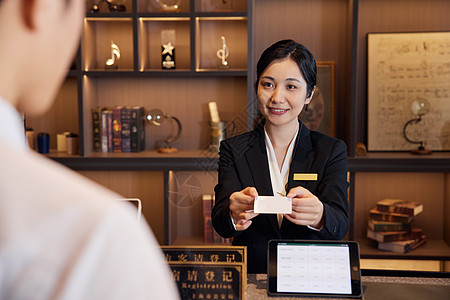 快捷酒店前台女服务员形象背景图片