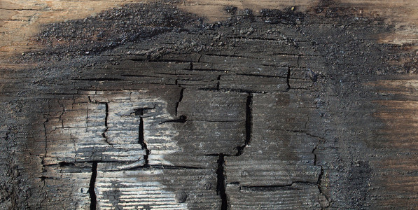 被火烧毁的木板灰烬背景图片