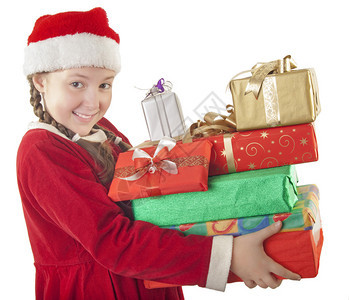 穿着圣诞服装和红圣塔帽的漂亮女孩手握着一堆礼物在白色下图片