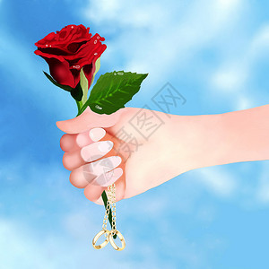 男子手持美丽的红玫瑰和订婚戒指求婚图片