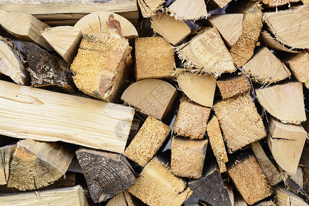 木柴背景两块硬木窑炉钻图片