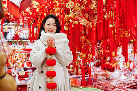 采购新年装饰的美女形象背景图片