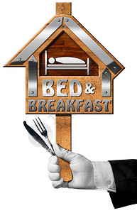 门卫手握着带有文字床早餐和银餐具的房屋形状标志图片