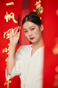春节对联国潮古风女性手拿毛笔背景