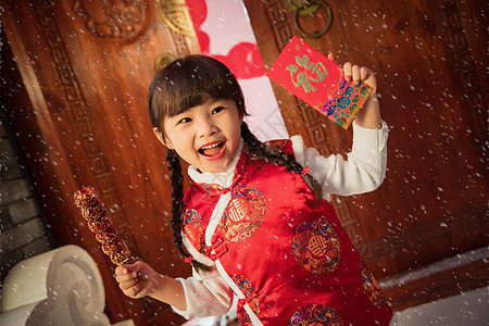 手拿红包的孩子手拿糖葫芦红包的快乐小女孩背景