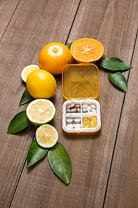 橙片柑桔类水果和药盒背景