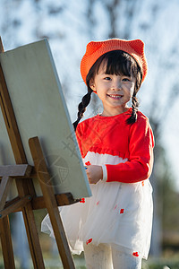 在画画小孩可爱的小女孩在户外画画背景