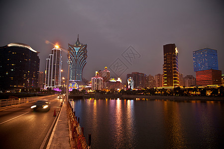 夜晚公路澳门城市建筑夜景背景