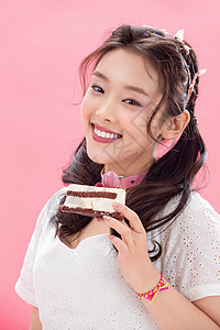 小蛋糕马卡龙年轻女孩吃蛋糕背景