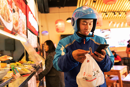 外卖员在餐厅取餐图片