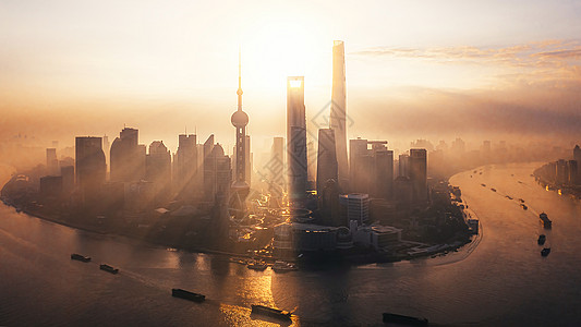 黎明的城市上海陆家嘴金融中心日出背景