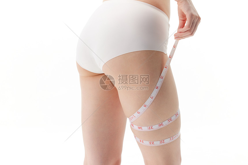 女子减肥用卷尺量腿围图片