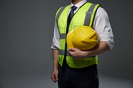劳动安全穿着安全服的建筑工人形象特写背景