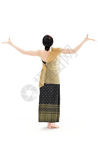 穿着傣族服饰舞蹈的女性背影图片