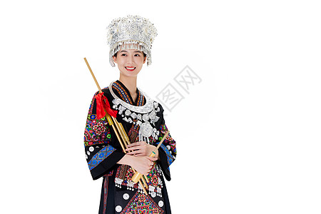 苗族美女使用民族乐器背景图片
