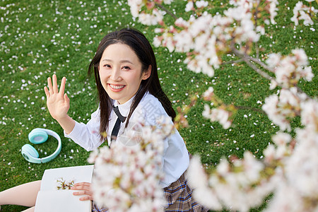 手绘少女俯视视角樱花下的少女打招呼背景