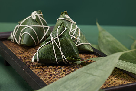 真空粽子绿色背景端午节传统粽子背景