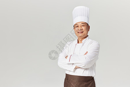 中年男性厨师抱胸形象背景图片
