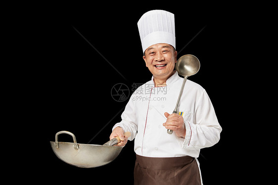 男性厨师拿着锅翻炒图片