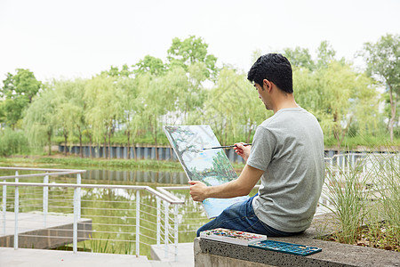 复古油画手拿画板户外写生的男性背景