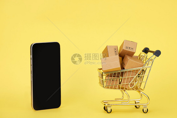 双十一网购概念手机和购物车图片