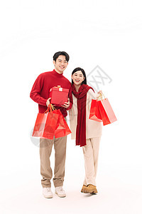 青年情侣快乐春节购物背景图片