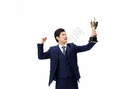 高举奖杯的商务男士背景图片