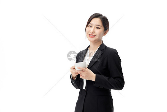 穿着正装手拿咖啡的职业女性形象图片