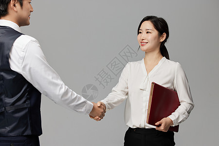 握手的商务男女背景图片