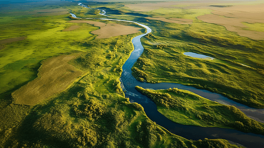 黄色一条河流横穿被草地环绕的土地图片