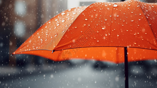 从橙色雨伞落下的雨滴高清图片