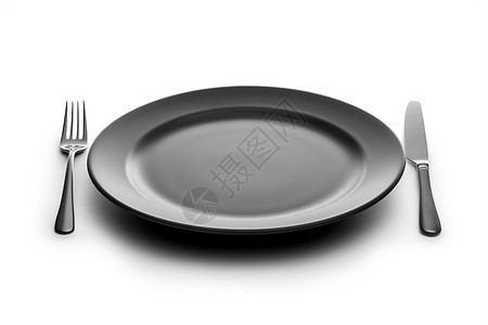 黑色的餐盘与刀叉图片