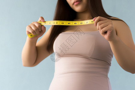 量腰围的肥胖女人高清图片