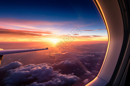 机舱外的日出天空背景图片