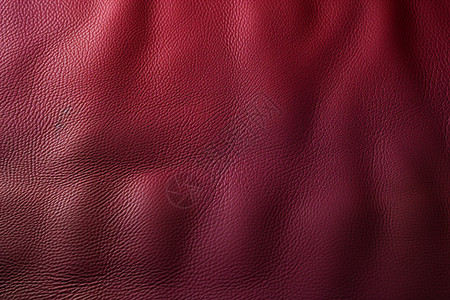 玫红色皮革制品的纹理细节背景图片