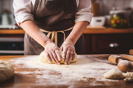 厨房内手工烘焙面包的面点师图片