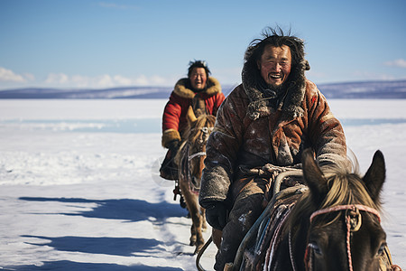 冬季雪地上骑马的牧民高清图片