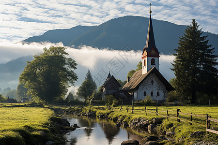 晨雾中的教堂和溪流图片