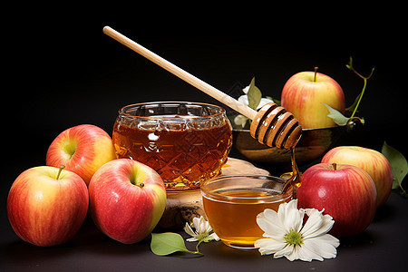 桌子上的新鲜苹果和蜂蜜图片