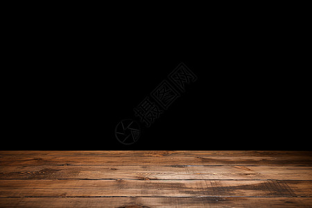黑色桌子黑色背景上的木地板背景