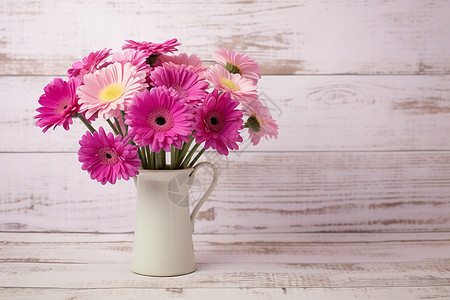 白色花瓶里的粉色花束图片