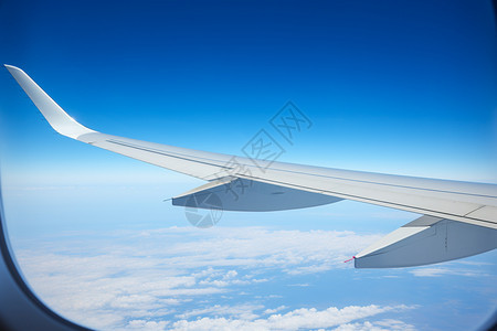 窗户外的飞机的翅膀图片