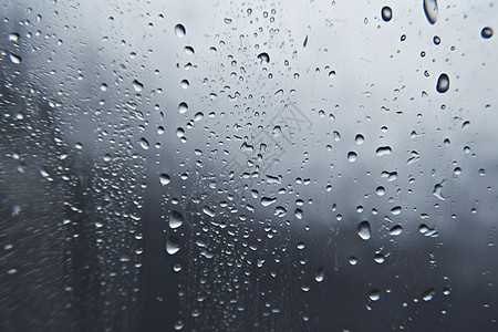 雨滴在玻璃窗上落下图片