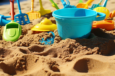 儿童沙坑沙滩上的玩具背景