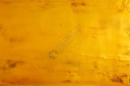 粗糙的墙壁上涂着金黄的油漆背景图片