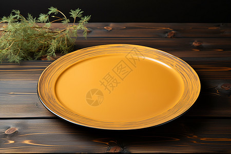 木桌上的黄色盘子图片