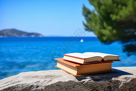 海岸上翻开的书本背景图片
